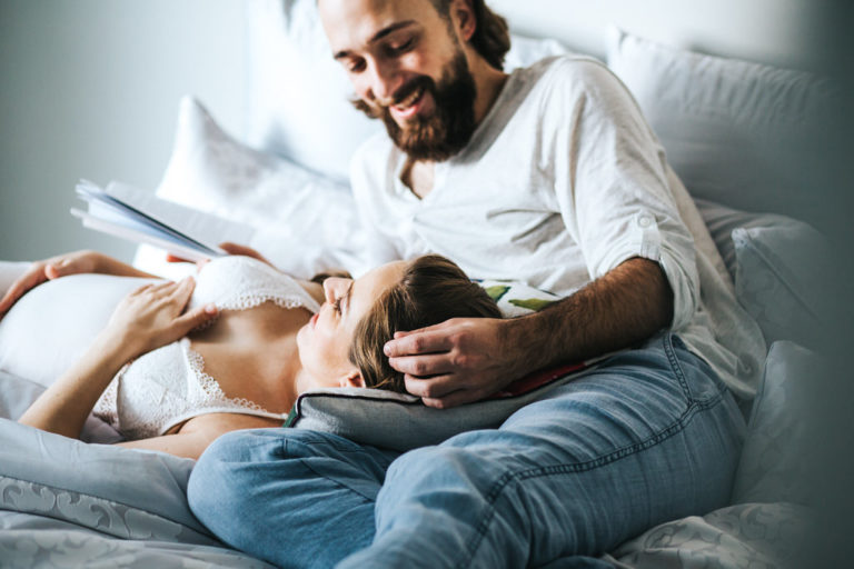 Calgary Maternity Photography Husband with Pregnant Wife in Bed