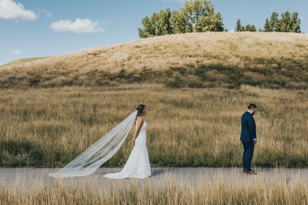 Bride and Groom First Look at Fishcreek Park, Alberta