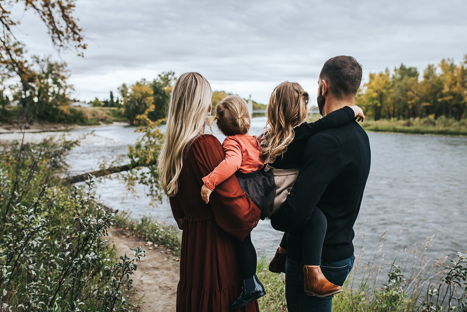 Parents with two girls at Carburn Park in Calgary