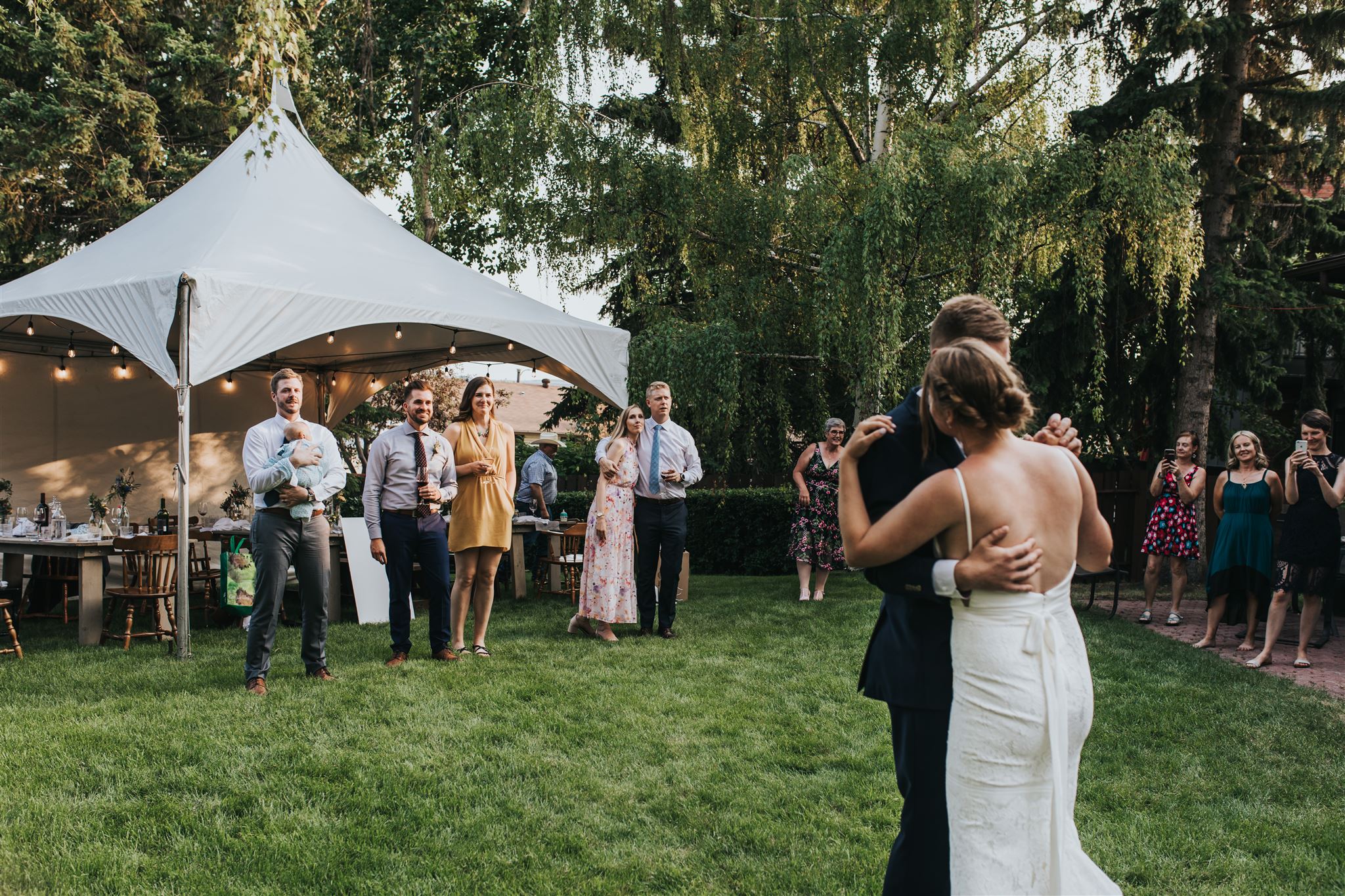Bride and Groom dancing during backyard wedding