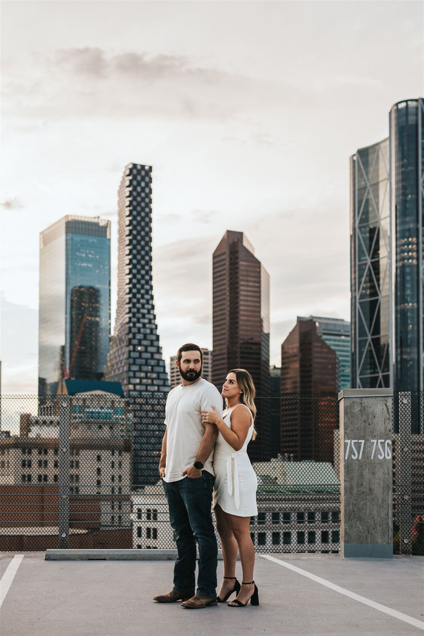 Couple on a rooftop in downtown Calgary, Alberta for their engagement photography session
