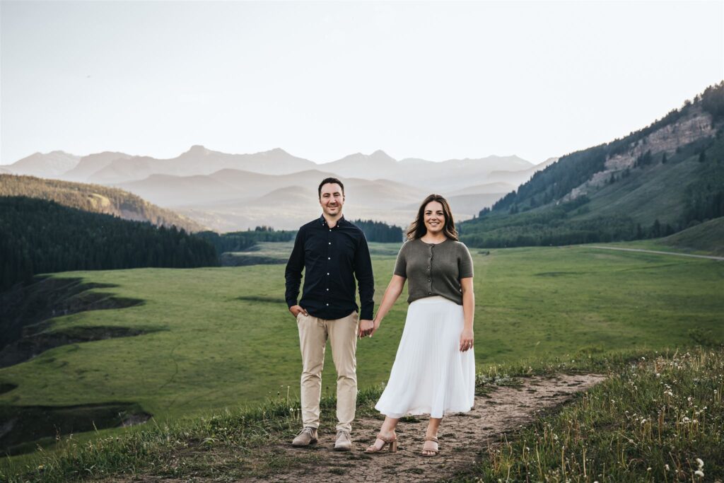 Calgary Engagement Photographer Sue Moodie Photogarphy Capturing an Engagement Session at golden hour with the mountains behind the couple.