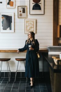 Calgary brand photographer Sue Moodie photographing realtor Ella Kuindersma during lifestyle session in downtown Calgary coffee shop