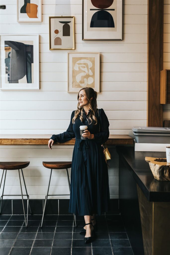 Calgary brand photographer Sue Moodie photographing realtor Ella Kuindersma during lifestyle session in downtown Calgary coffee shop