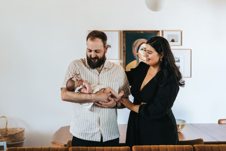 Calgary newborn photography with new parents and their baby girl at home by Calgary newborn photographer Sue Moodie Photography.