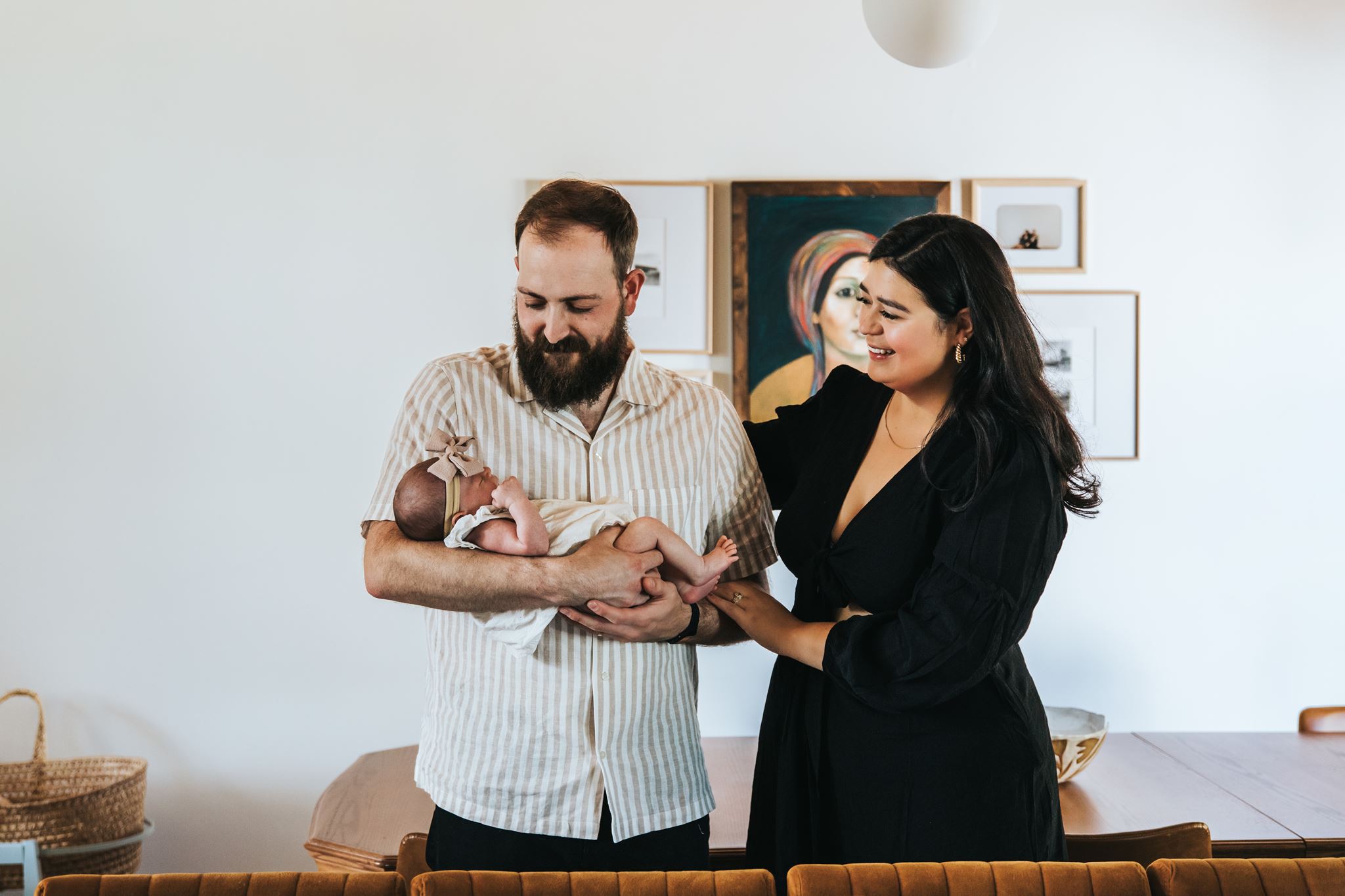 Calgary newborn photography with new parents and their baby girl at home by Calgary newborn photographer Sue Moodie Photography.